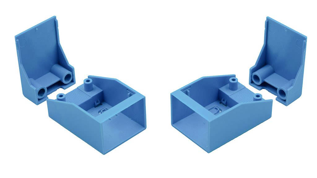Two sets of blue plastic end caps for rectangular profiles, each set including a flat cover piece and a hollow base piece with cylindrical and rectangular slots