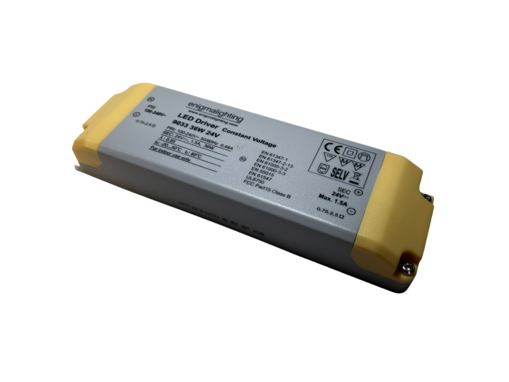 Enigma Lighting LED Driver 36W 24V, rectangular silver and yellow unit with electrical specifications and certification labels printed on the top, used for powering 24V LED lighting systems.