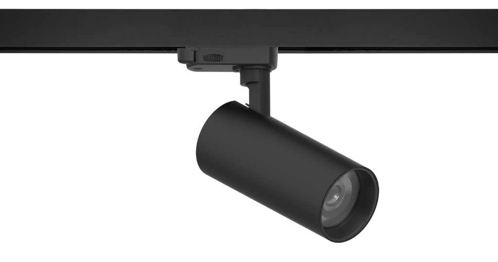 Ceiling-mounted track light fixture with a cylindrical shape, angled downward, attached to a rectangular track.